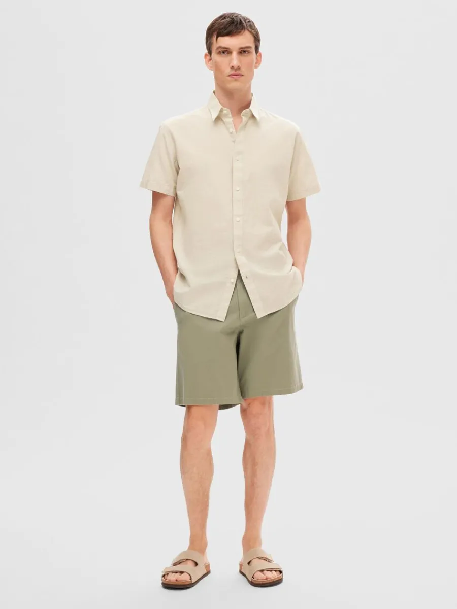 klassiska_kortrmad_skjort_1-1.webp SELECTED KLASSISKA KORTÄRMAD SKJORTA Beige Outlet