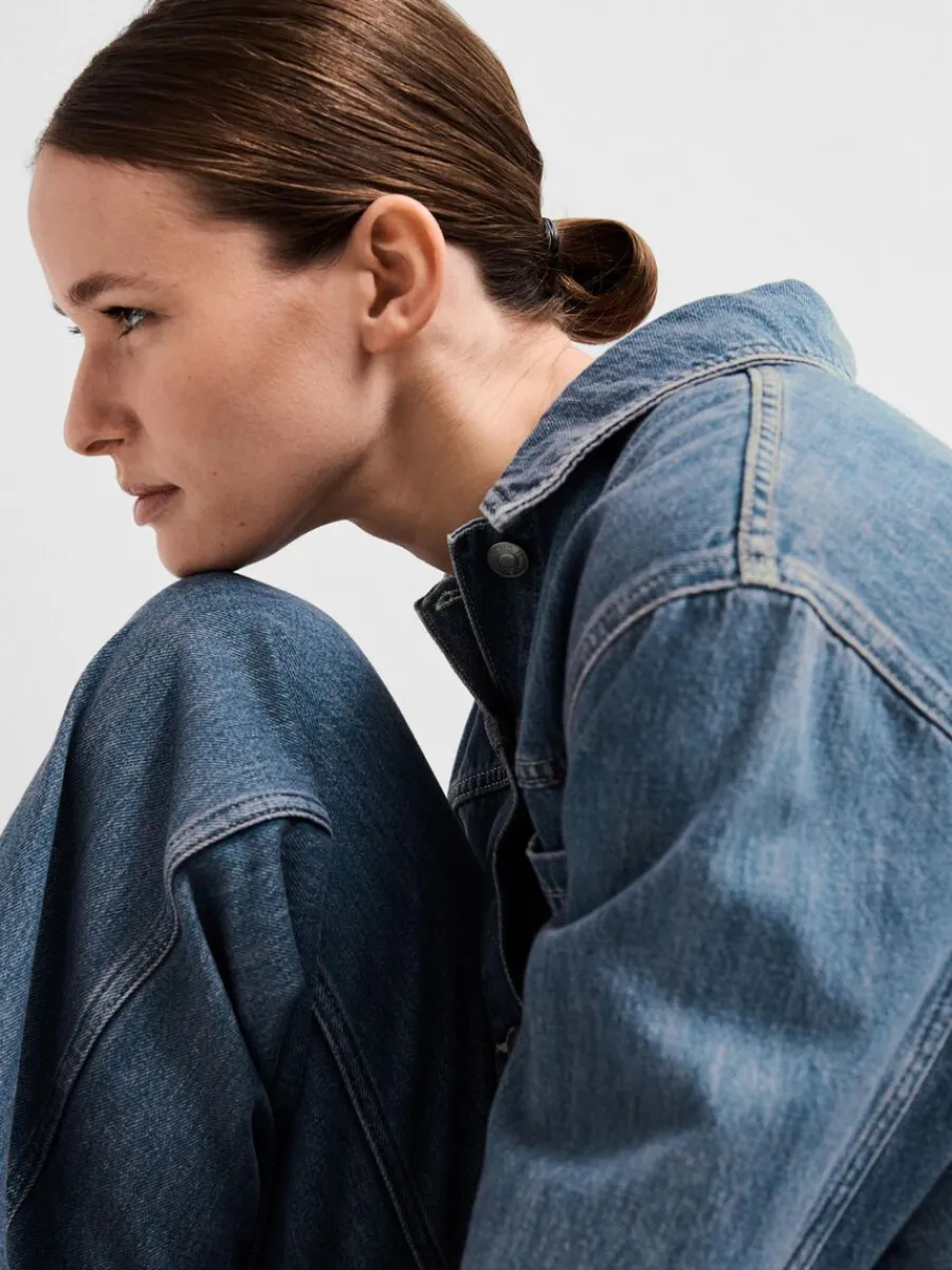 mellantvttad_denim_jumpsu_2.webp SELECTED MELLANTVÄTTAD DENIM JUMPSUIT Blue Shop